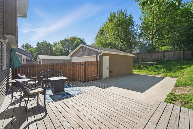 7052 Plum Dr, Urbandale, IA 50322 - wooden terrace with an outdoor structure and a patio area