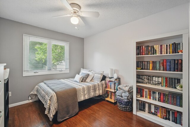 7052 Plum Dr, Urbandale, IA 50322 - bedroom featuring wood finished floors, ceiling fan, a textured ceiling, and baseboards