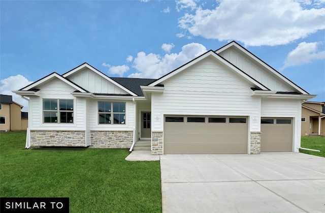 2615 SE Kettleridge Ln, Waukee, IA 50263 - craftsman-style home with board and batten siding, stone siding, an attached garage, and driveway