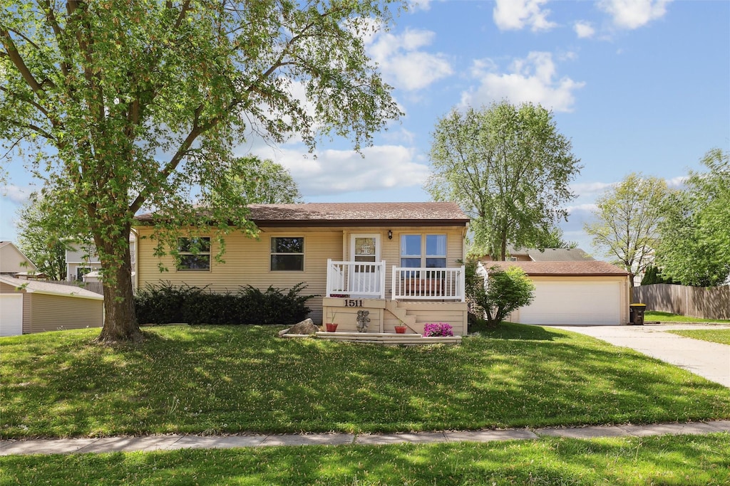 view of front of home with driveway and a garage