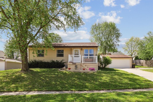 view of front of home with driveway and a garage