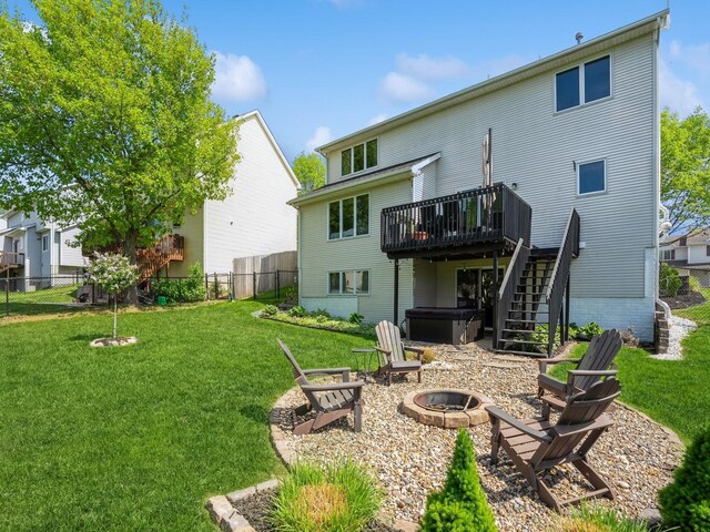 5031 Cherrywood Dr, West Des Moines, IA 50265 - rear view of property with a hot tub, an outdoor fire pit, a deck, and stairs