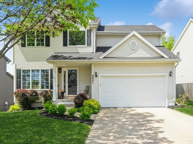 5031 Cherrywood Dr, West Des Moines, IA 50265 - traditional home with concrete driveway, roof with shingles, and an attached garage
