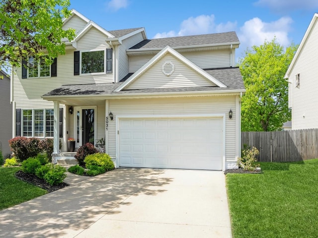 5031 Cherrywood Dr, West Des Moines, IA 50265 - traditional-style home with concrete driveway, an attached garage, and a shingled roof