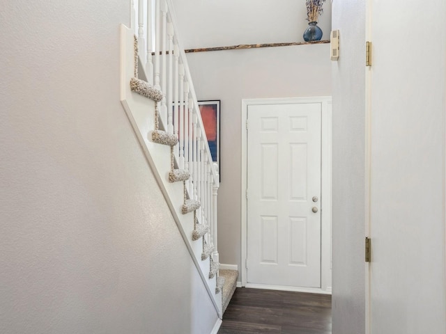 5031 Cherrywood Dr, West Des Moines, IA 50265 - entryway with dark wood-style flooring, stairway, and baseboards