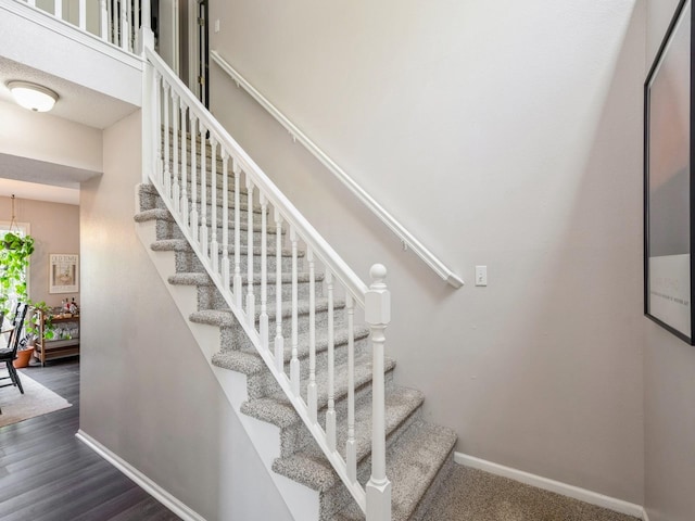 5031 Cherrywood Dr, West Des Moines, IA 50265 - staircase with baseboards and wood finished floors