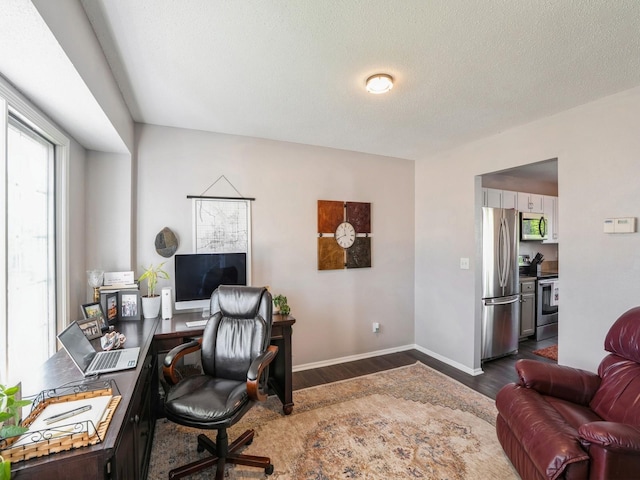 5031 Cherrywood Dr, West Des Moines, IA 50265 - home office with dark wood finished floors, baseboards, and a textured ceiling