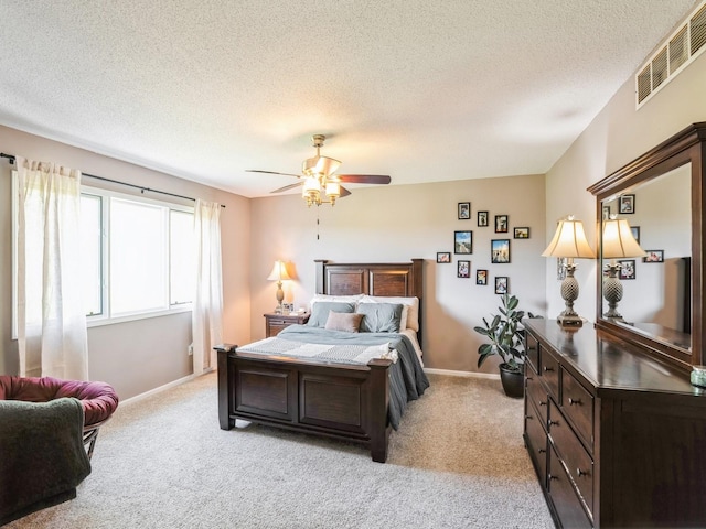 5031 Cherrywood Dr, West Des Moines, IA 50265 - bedroom with light colored carpet, a textured ceiling, baseboards, and a ceiling fan