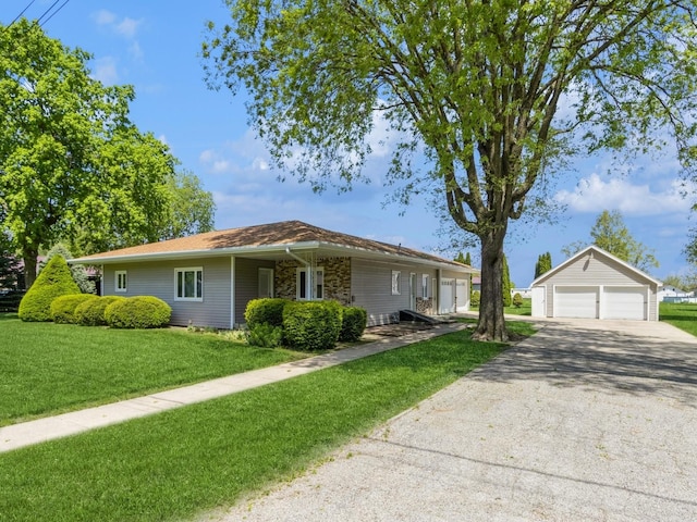 ranch-style house with an outbuilding, a front lawn, and a garage