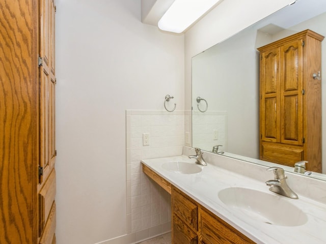 full bath with double vanity, tile walls, and tile patterned flooring