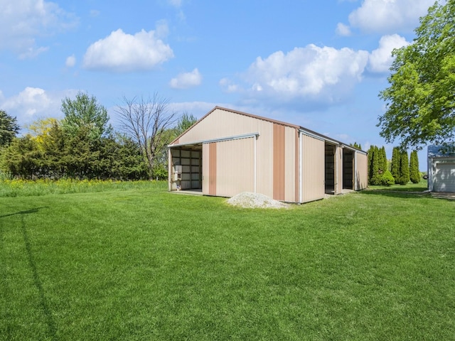 view of pole building with a lawn