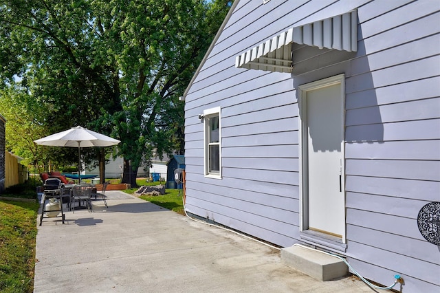 view of patio / terrace featuring fence and outdoor dining space