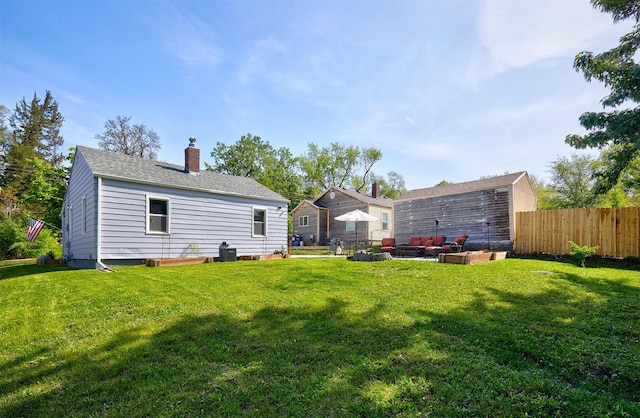 view of yard featuring an outdoor living space and central air condition unit