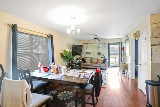 1424 Cleveland Ave, Des Moines, IA 50316 - dining area featuring wood finished floors, ceiling fan, and a chandelier