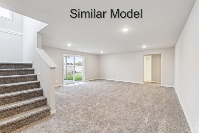 basement featuring carpet flooring, stairway, recessed lighting, and baseboards