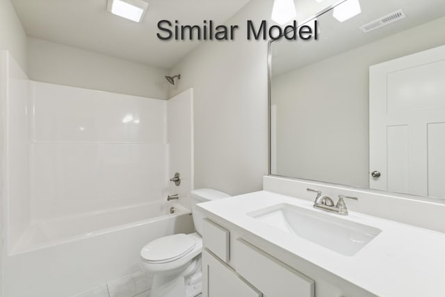bathroom featuring toilet, shower / bath combination, tile patterned flooring, and vanity