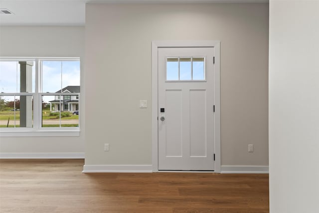 1998 S Warrior Ln, Waukee, IA 50263 - foyer entrance featuring plenty of natural light and wood finished floors