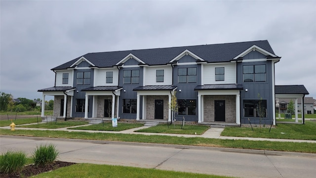 1998 S Warrior Ln, Waukee, IA 50263 - multi unit property featuring a standing seam roof, metal roof, and stone siding