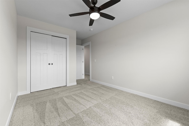1998 S Warrior Ln, Waukee, IA 50263 - unfurnished bedroom with baseboards, carpet floors, a closet, and ceiling fan