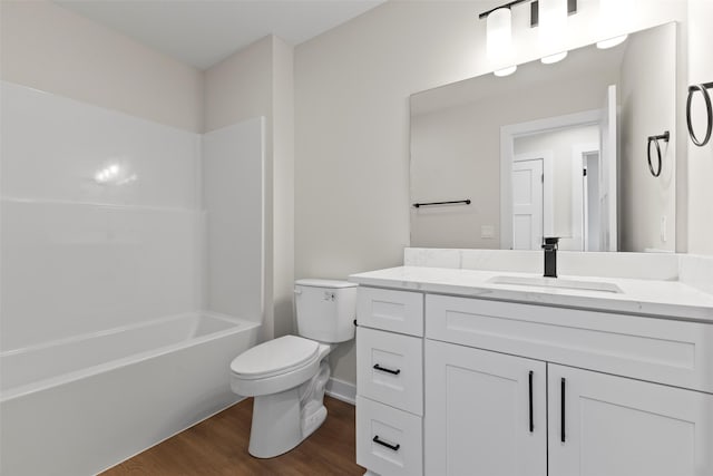 1998 S Warrior Ln, Waukee, IA 50263 - full bathroom with toilet, vanity, wood finished floors, and shower / tub combination