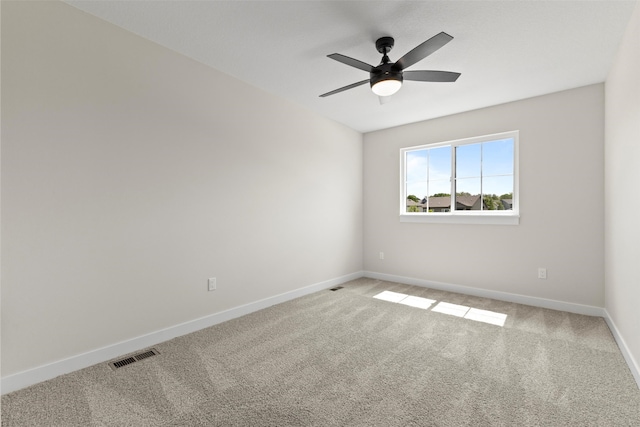 1998 S Warrior Ln, Waukee, IA 50263 - spare room with light colored carpet, baseboards, and ceiling fan