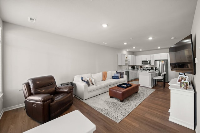 9556 Crestview Dr, West Des Moines, IA 50266 - living room with dark wood-type flooring, recessed lighting, and baseboards