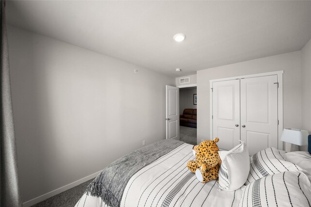 9556 Crestview Dr, West Des Moines, IA 50266 - bedroom with carpet floors, baseboards, and a closet