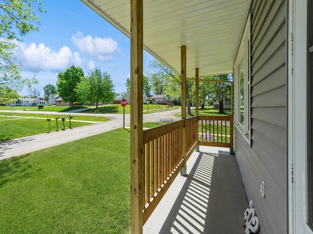 view of patio / terrace featuring covered porch and a residential view