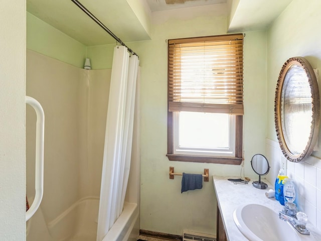 bathroom featuring shower / bathtub combination with curtain and vanity