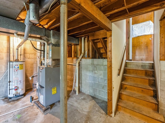 unfinished basement with gas water heater, heating unit, and stairs