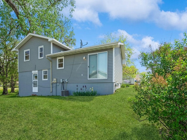 back of property with a lawn