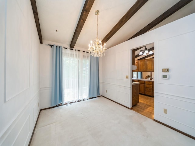 unfurnished dining area featuring a chandelier, light colored carpet, and a decorative wall