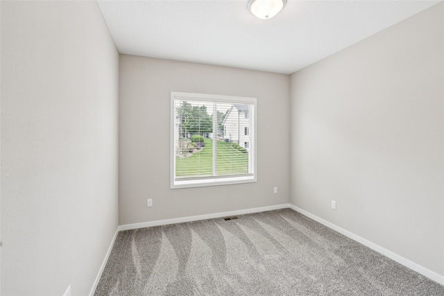 2331 N 8th Ave E, Newton, IA 50208 - empty room featuring carpet and baseboards