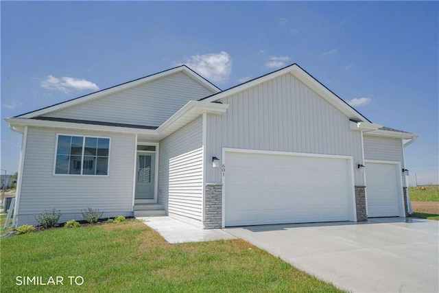 4416 NE 8th St, Ankeny, IA 50021 - view of front of property featuring an attached garage, entry steps, driveway, and a front yard