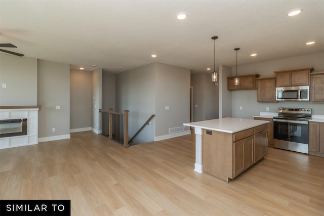 4416 NE 8th St, Ankeny, IA 50021 - kitchen with appliances with stainless steel finishes, light wood-style floors, recessed lighting, open floor plan, and light countertops