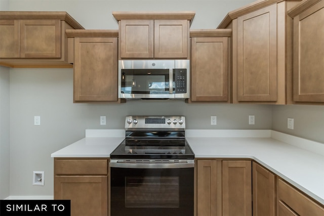 4416 NE 8th St, Ankeny, IA 50021 - kitchen featuring stainless steel appliances and light countertops