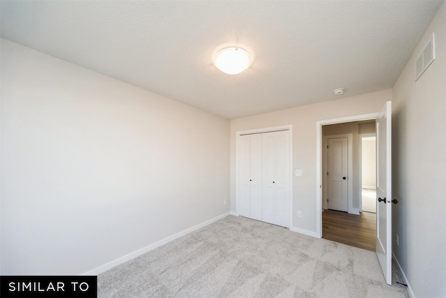 4404 NE 8th St, Ankeny, IA 50021 - unfurnished bedroom featuring carpet floors, baseboards, and a closet