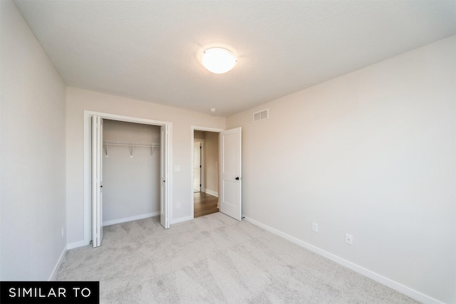 4404 NE 8th St, Ankeny, IA 50021 - unfurnished bedroom with carpet flooring, baseboards, and a closet