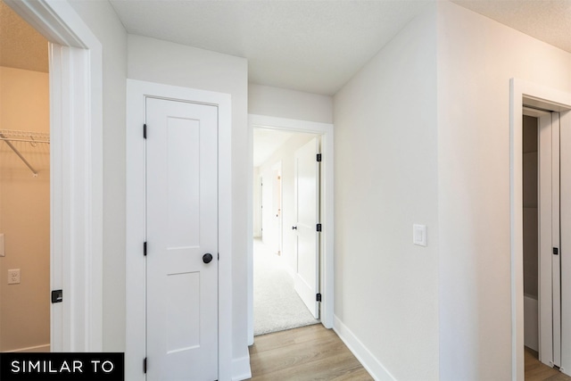4404 NE 8th St, Ankeny, IA 50021 - hallway with light wood-style flooring and baseboards