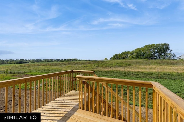 wooden deck featuring a view of rural / pastoral area