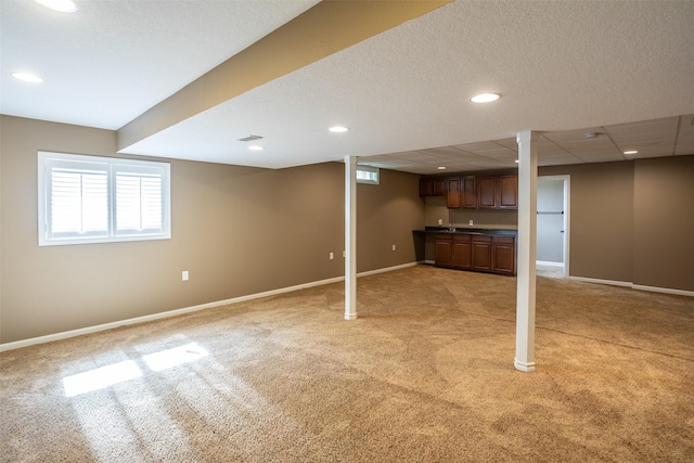 15046 Summit Dr, Clive, IA 50325 - below grade area with light colored carpet, plenty of natural light, wet bar, and recessed lighting