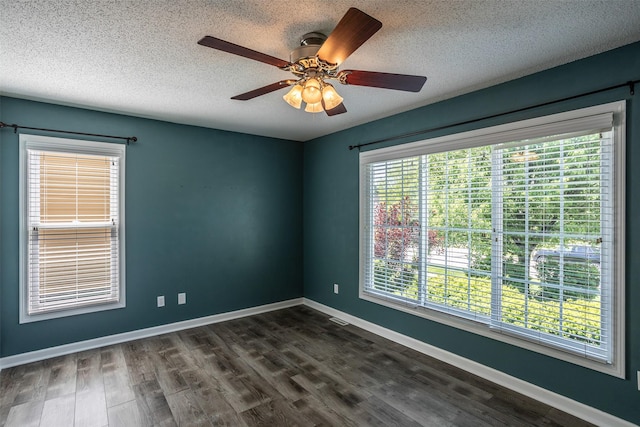 15046 Summit Dr, Clive, IA 50325 - empty room featuring dark wood-style flooring, a textured ceiling, and a ceiling fan