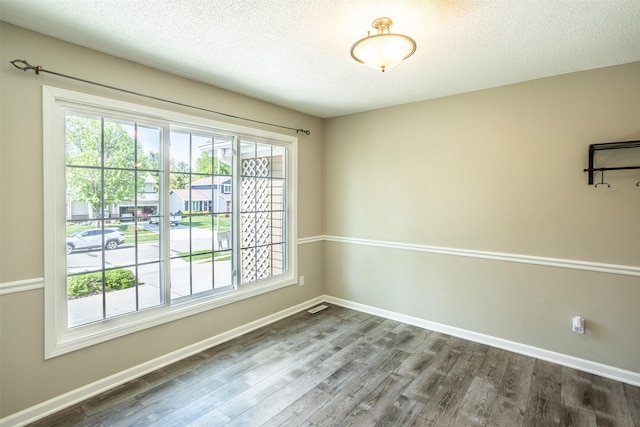 15046 Summit Dr, Clive, IA 50325 - spare room with dark wood-style floors and a textured ceiling