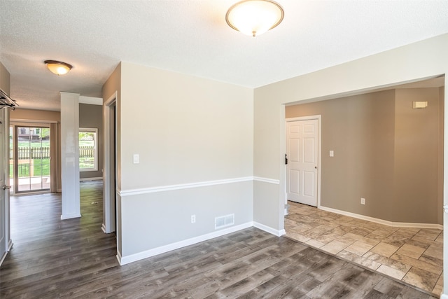 15046 Summit Dr, Clive, IA 50325 - spare room with dark wood-style floors and a textured ceiling