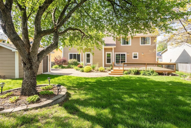 15046 Summit Dr, Clive, IA 50325 - back of house featuring a wooden deck, a yard, and roof with shingles