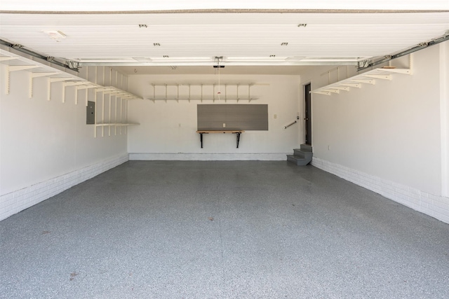 15046 Summit Dr, Clive, IA 50325 - garage featuring electric panel and a garage door opener