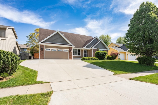 15046 Summit Dr, Clive, IA 50325 - view of front of home featuring brick siding, a garage, and driveway
