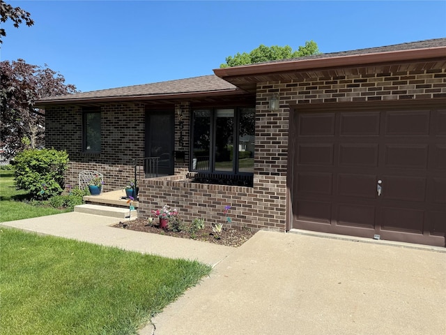 doorway to property with brick siding and driveway