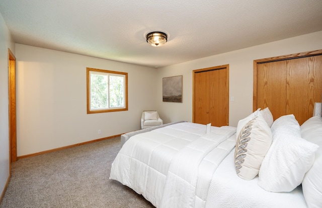 10476 Ricardo Rd, Clive, IA 50325 - bedroom featuring carpet, baseboards, and multiple closets