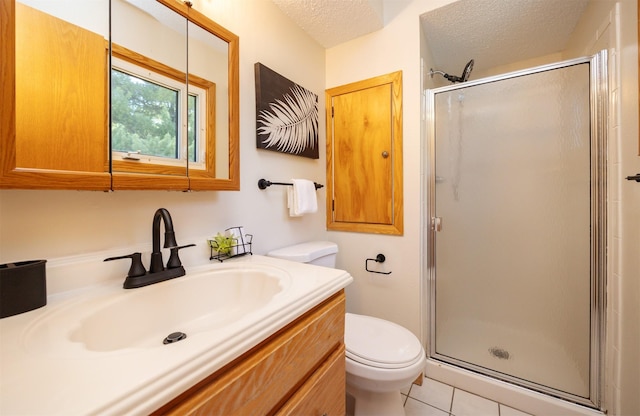 10476 Ricardo Rd, Clive, IA 50325 - bathroom with toilet, a shower stall, vanity, tile patterned floors, and a textured ceiling